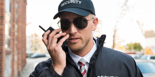 security-guard-talking-on-walkie-talkie_sizel_ddf796